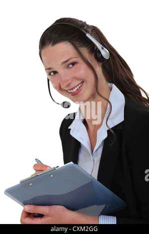 Cheerful call-center supervisor with clip-board Stock Photo