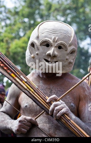 Mud man wearing a mud mask at the singsing Goroka Festival, Papua New Guinea Stock Photo