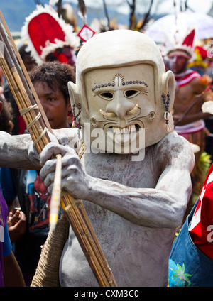 Mud man wearing a mud mask at the singsing Goroka Festival, Papua New Guinea Stock Photo