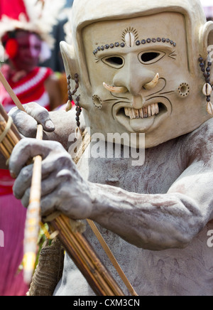 Mud man wearing a mud mask at the singsing Goroka Festival, Papua New Guinea Stock Photo