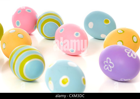 Brightly colored Easter eggs on white background with copy space Stock Photo