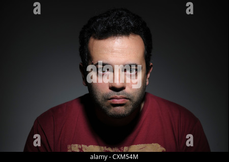 Low key portrait of a young man Stock Photo