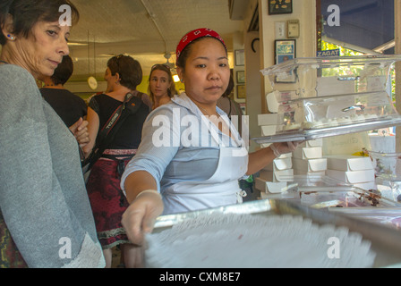 New York City, NY, USA, Woman Shopping in American Bakery Shop 'Magnolia' in Greenwich Village, Manhattan, women nyc, diverse america, Asian Clerk Serving Stock Photo