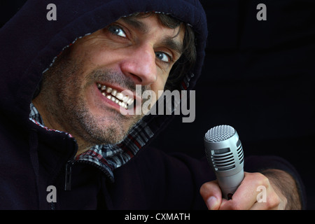 Rockstar singing over black background Stock Photo