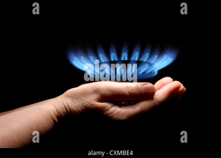 Hands holding a flame gas Stock Photo