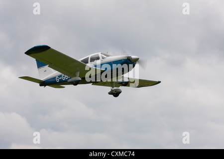 Piper PA-28-180 Cherokee G-GBRB in flight Stock Photo