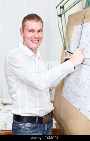 Happy engineering worker in the workplace near panel board Stock Photo