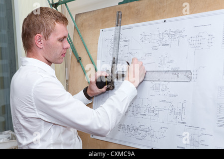 Engineer making a blueprint project with old-fashioned drawing board Stock Photo