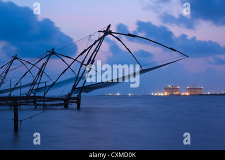 Kochi chinese fishnets on sunset. Fort Cochin, Kochi, Kerala, India Stock Photo