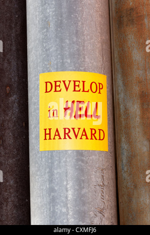 Sticker near Harvard University's main campus protesting against the ivy league institution's expansion plans in Allston, MA. Stock Photo