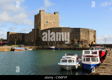 View across the water to 12th century Norman castle 1177 on Belfast Lough in Carrickfergus, County Antrim, Northern Ireland, UK Stock Photo