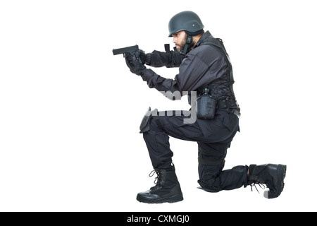 a swat agent wearing a bulletproof vest and aiming with a gun Stock Photo