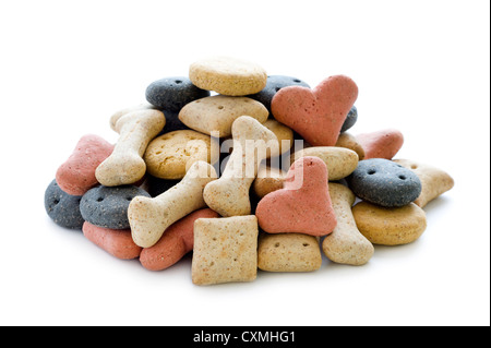 dry dog biscuits in a heap isolated on white background Stock Photo