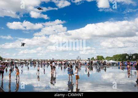 The Water mirror public artwork reflecting the sky on Stock Exchange Square, Bordeaux city, France, Europe Stock Photo