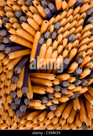 New, sharp blue and brown leaded pencils seen from above. One of the pencils at the top is the wrong way up. Stock Photo