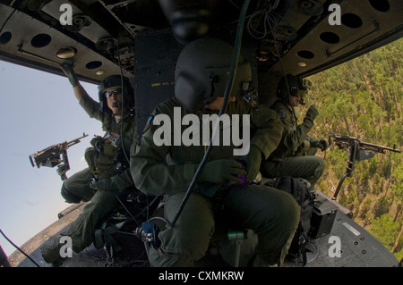 A US Air Force UH-1N helicopter banks sharply during a tactical maneuver during special forces training September 19, 2012 in southern Alabama. Stock Photo