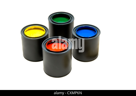 Four cans of primary colored paints on a white background, including yellow, green, blue and red Stock Photo