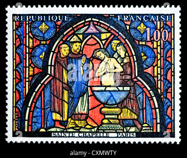 Unused 1966 French postage stamp depicting 'Baptism of Judas' stained glass window, Paris. Stock Photo