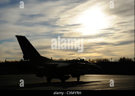 An F-16 Fighting Falcon assigned to the 35th Fighter Squadron, Kunsan Air Base, Korea, taxis down the runway during Distant Frontier Oct. 3, 2012, Eielson Air Force Base, Alaska. Distant Frontier is an exercise in which participants test unit assets in preparation for RED FLAG-Alaska. Stock Photo