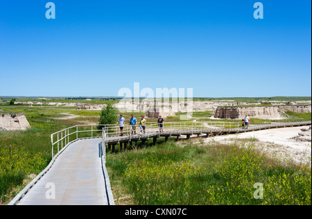 Tourists on boardwalk of the Door Trail, Badlands National Park, South Dakota, USA Stock Photo