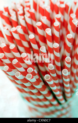 Bunch of red and white striped paper straws with some with stars on