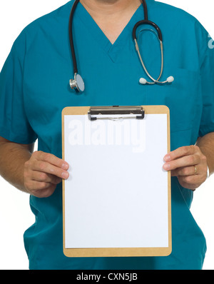 Doctor or nurse with scrubs and a stethoscope holding a blank clipboard, copy space Stock Photo
