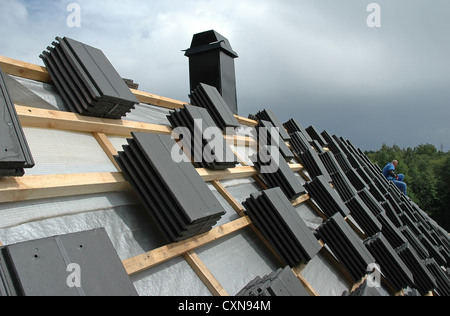 roofer working on the roof Stock Photo