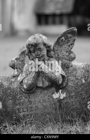 Black & White portrait - Angel gravestone in Priors Dean Hampshire UK Stock Photo