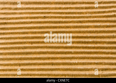 Texture of brown corrugate cardboard as background Stock Photo