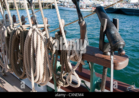 Belaying pins and ropes on Tall Sailing Ship in Harbour of San Diego California USA Stock Photo