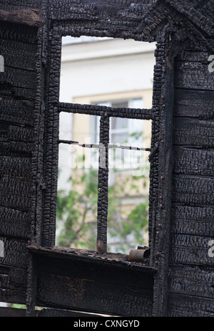 Burned wooden window frame Stock Photo
