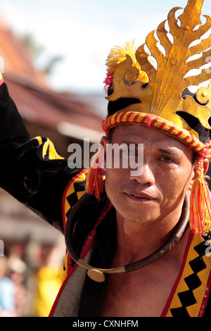 Indonesia, Sumatra, Nias. Man in traditional dress performing ancient Nias war dance. Stock Photo