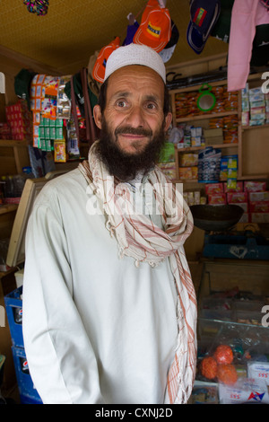 Muslim man in a shop at Krakl Village, Bumburet Valley, Chitral, Khyber-Pakhtunkhwa, Pakistan Stock Photo