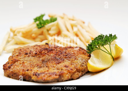 Beef cutlet / Wiener Schnitzel with french fries Stock Photo