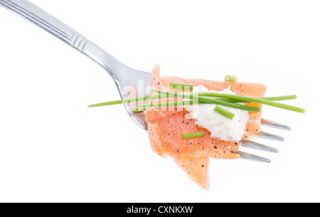 Portion of Salmon on a fork against white background Stock Photo