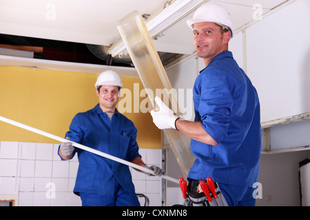 Installing neon lamp Stock Photo
