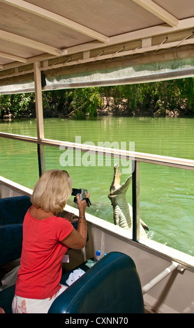 Tourist snaps photo of a freshwater Crocodile (Crocodylus johnstoni) at Hartley's Crocodile Adventures in Cairns, Australia Stock Photo