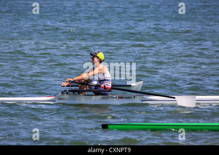 single rower at University river regatta rowing for trophies Surfers ...