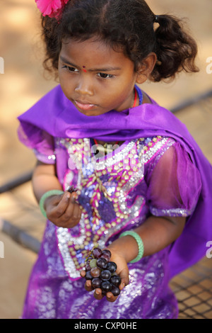 Young Indian girl eating grapes Andhra Pradesh South India Stock Photo ...