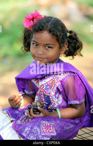Young Indian girl eating grapes Andhra Pradesh South India Stock Photo ...