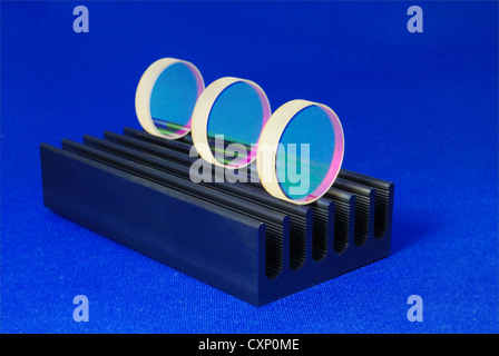 specially coated optical mirrors for laser industry and science on the black metallic rail; selective focus on front mirror Stock Photo