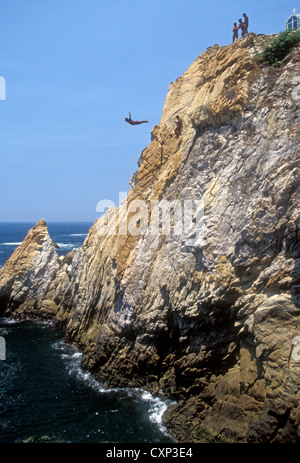 cliff diver cliff divers cliff diving at La Quebrada in Acapulco Bay, Bahia de Acapulco, in city of Acapulco in Guerrero State Mexico Stock Photo