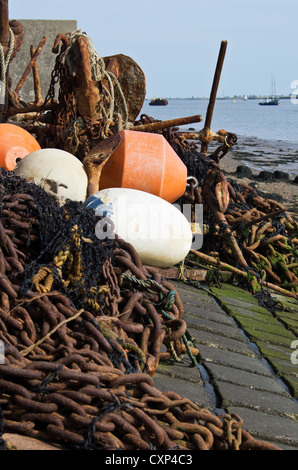 Buoys and anchors on the seawall. Burnham on Crouch, Essex Stock Photo