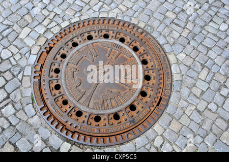 iron plate on pavement Berlin Germany Stock Photo