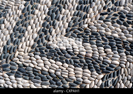 Traditional black and white mosaic paving, Greece Stock Photo