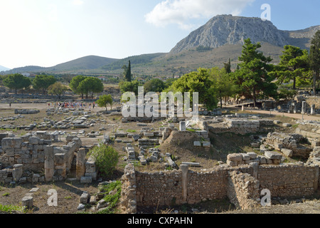 View of Agora with Acrocorinth Rock behind, Ancient Corinth, Corinth Municipality, Peloponnese region, Greece Stock Photo