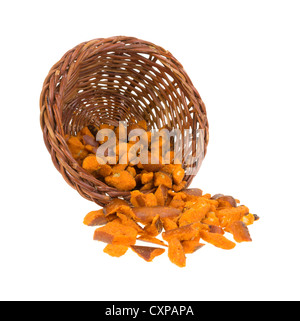 A wicker basket with spicy pretzel pieces falling onto a white background. Stock Photo