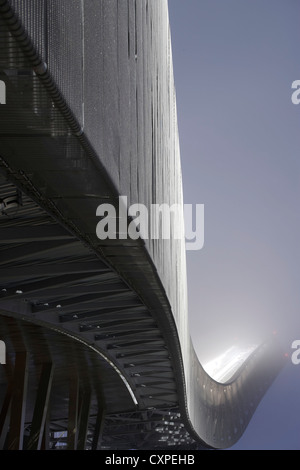 Holmenkollen Ski Jump, Holmenkollen, Norway. Architect: JDS Architects, 2011. Foggy dusk shot looking up at jump. Stock Photo