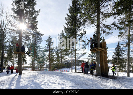 Holmenkollen Ski Jump, Holmenkollen, Norway. Architect: JDS Architects, 2011. Obstacle course in the trees with jump in the dist Stock Photo