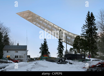 Holmenkollen Ski Jump, Holmenkollen, Norway. Architect: JDS Architects, 2011. View of jump at sunset. Stock Photo